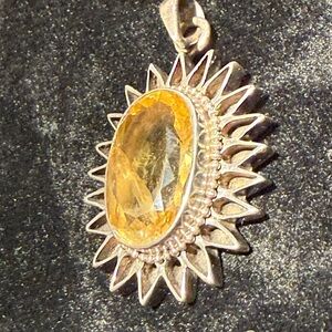 Elegant Silver and Gold Sunburst Pendant